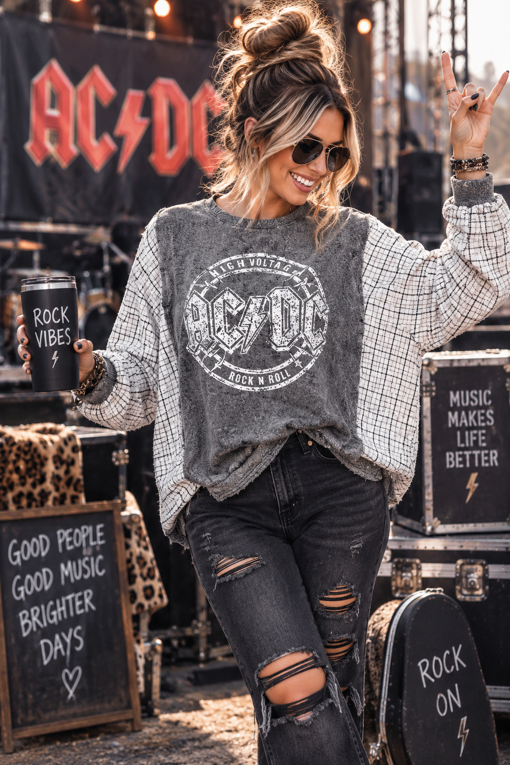 Model wearing upcycled AC/DC High Voltage sweatshirt with black and white plaid flannel sleeves and ribbed cuffs, size 2X